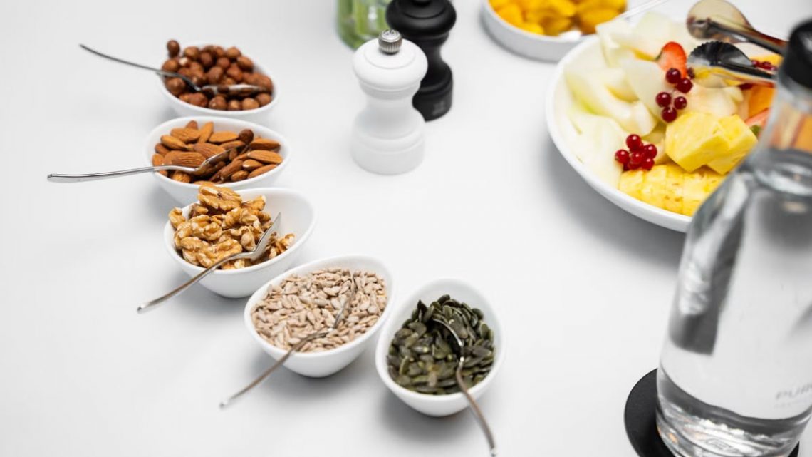 A top view of a diverse breakfast spread with nuts and fresh fruits for a nutritious start.